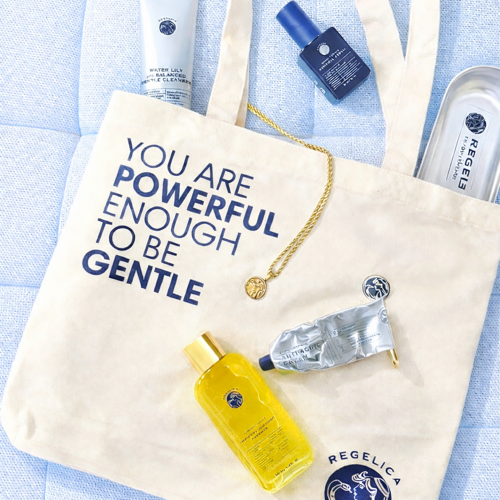 Tote bag with motivational quote and beauty products on a light blue background